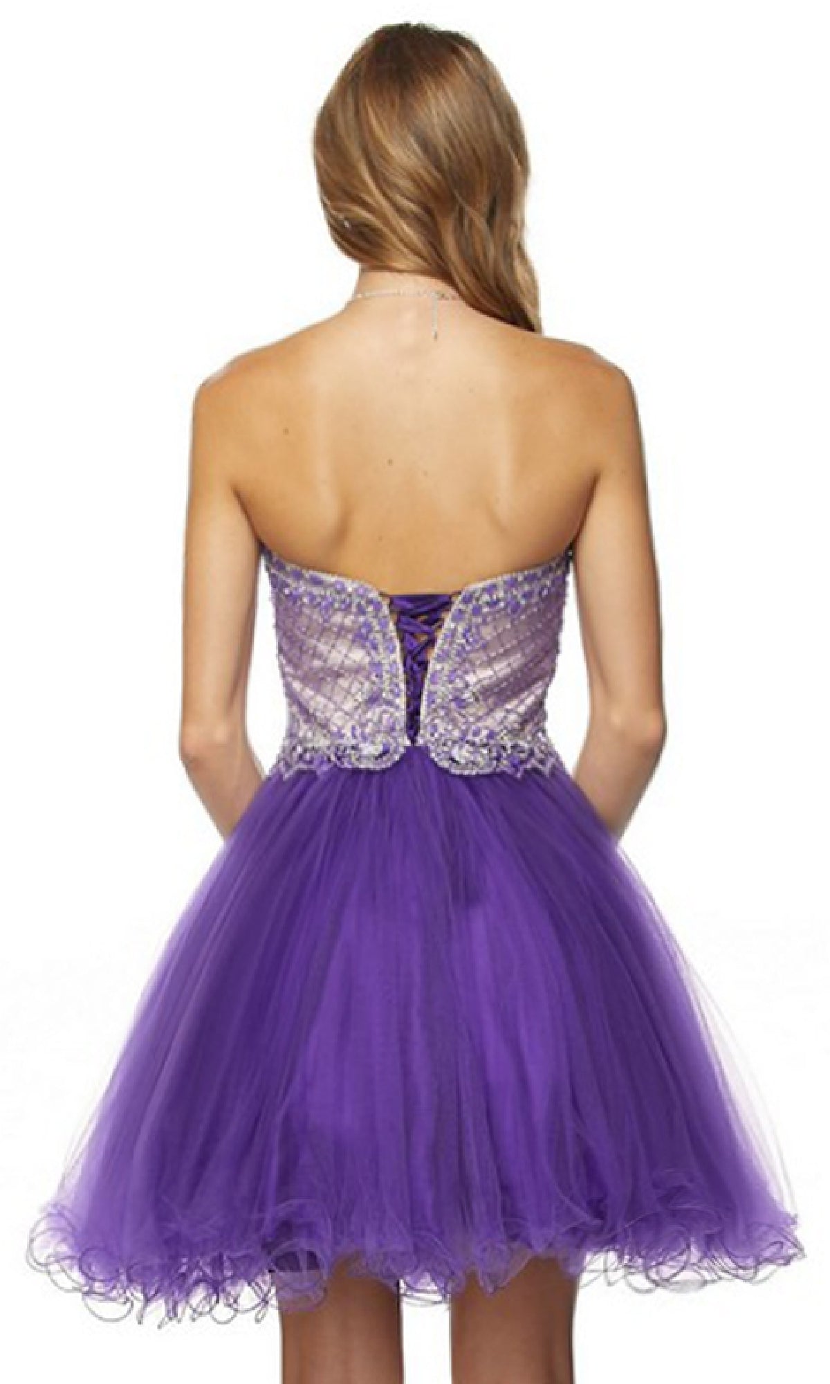 A woman with long hair, seen from behind, wears the Juliet 778 short babydoll HOCO dress in purple—with a strapless sweetheart neckline, fitted embellished bodice, lace-up back, and tulle skirt.
